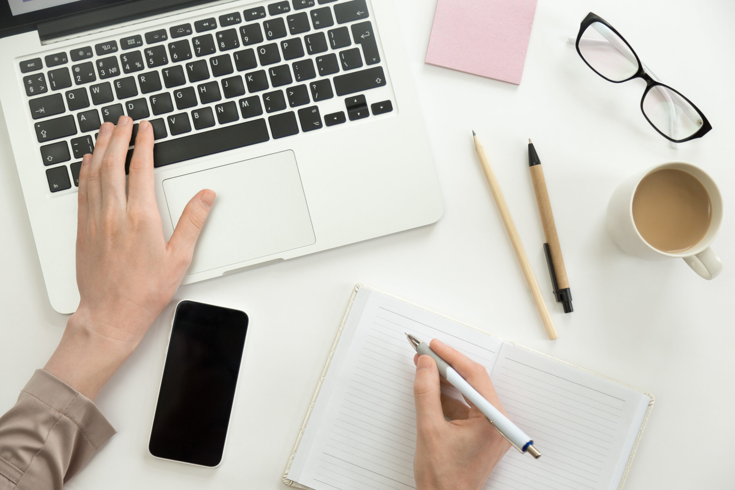 Hand Working On A Laptop, Another Holding A Pen Hand Working On A Laptop, Another Holding A Pen