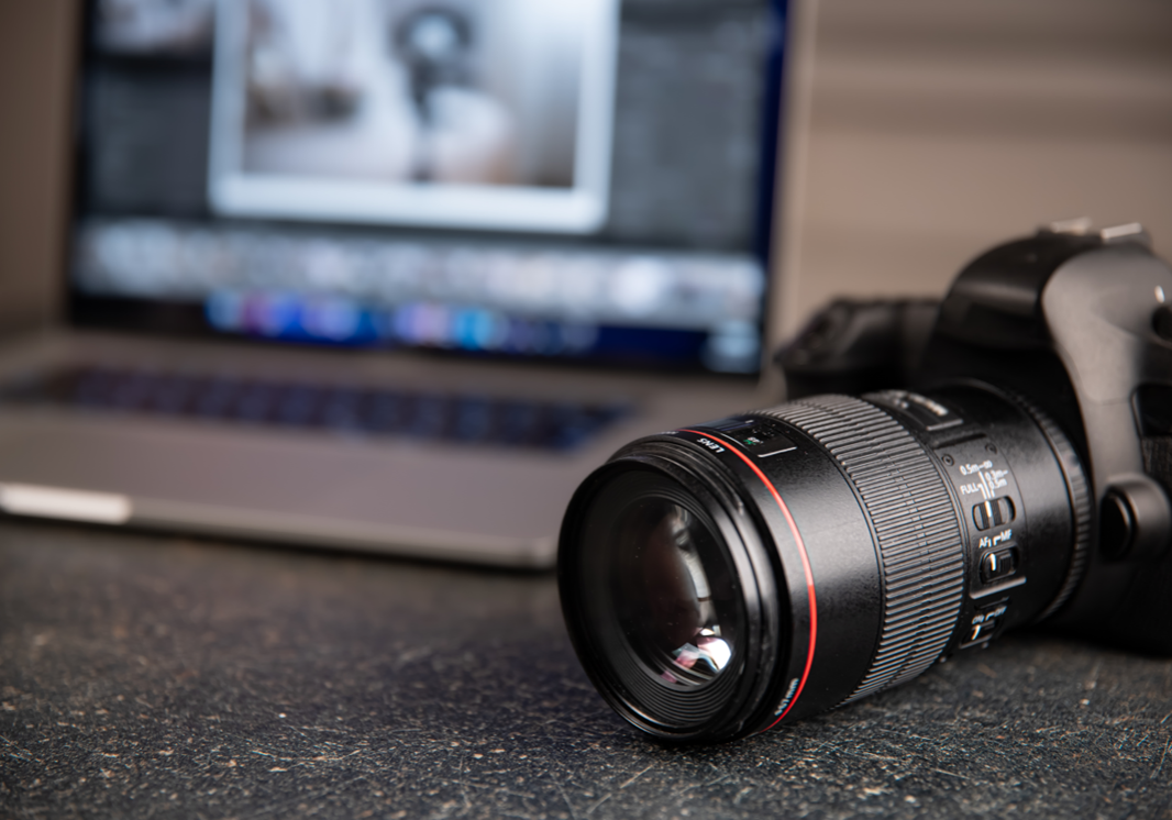 Business Photography camera with lens sitting on table