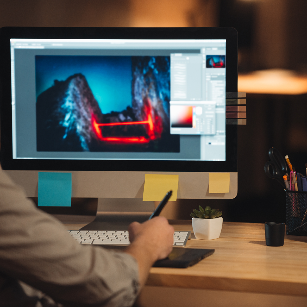 young-concentrated-bearded-web-designer-dressed-in-shirt-working-late-at-night-and-loo-SBI-302895449